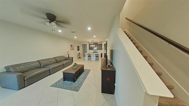 tiled living room featuring ceiling fan