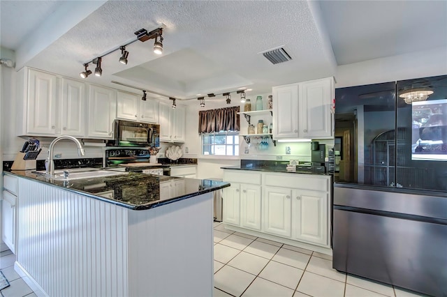 kitchen with a textured ceiling, white cabinetry, and black appliances