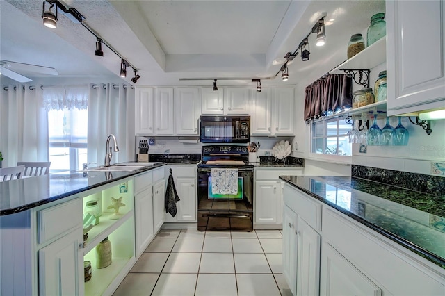 kitchen featuring ceiling fan, light tile patterned flooring, sink, white cabinetry, and black appliances