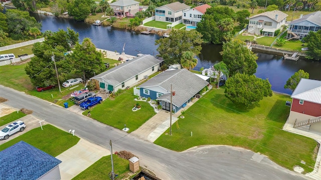 aerial perspective of suburban area featuring a nearby body of water