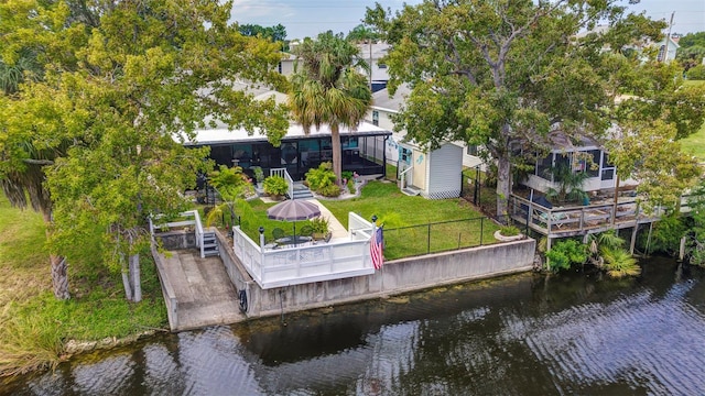 birds eye view of property with a water view