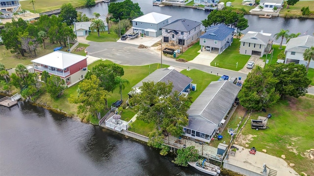 aerial perspective of suburban area with a large body of water