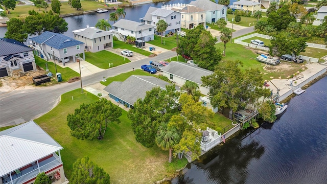 aerial perspective of suburban area featuring a large body of water