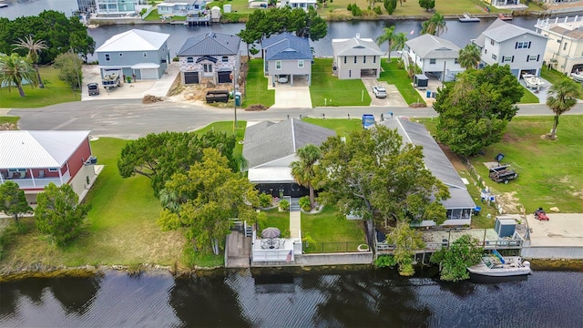 aerial perspective of suburban area with a large body of water