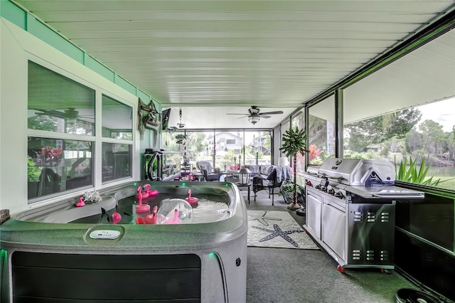 sunroom featuring ceiling fan