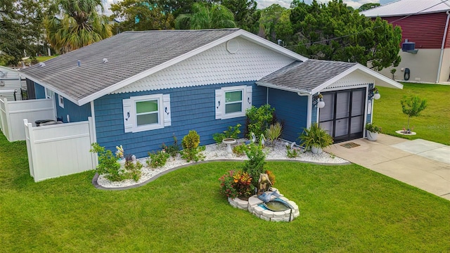 view of front of home featuring a garage and a front yard