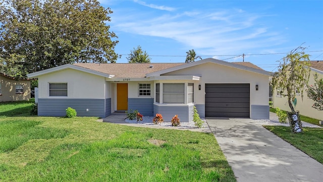 single story home with a front yard and a garage