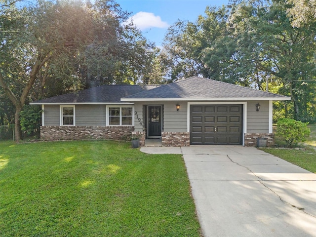 ranch-style home featuring a front yard and a garage