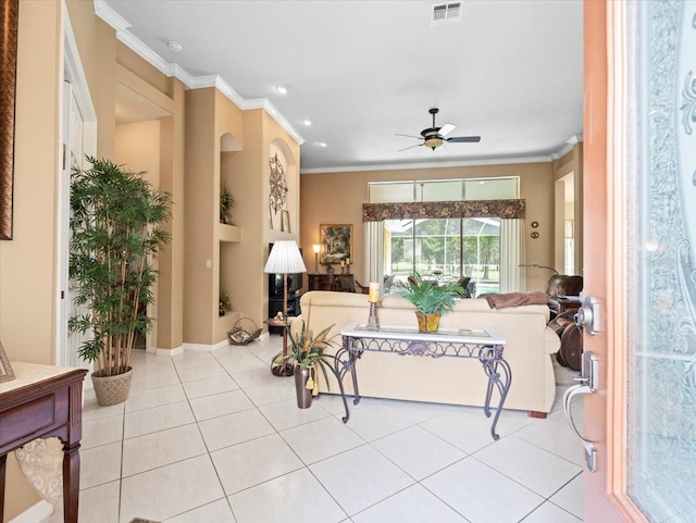 living room with crown molding, light tile patterned flooring, and ceiling fan