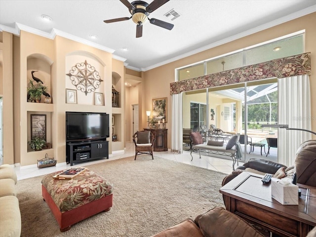 living room with ceiling fan, ornamental molding, and light tile patterned floors