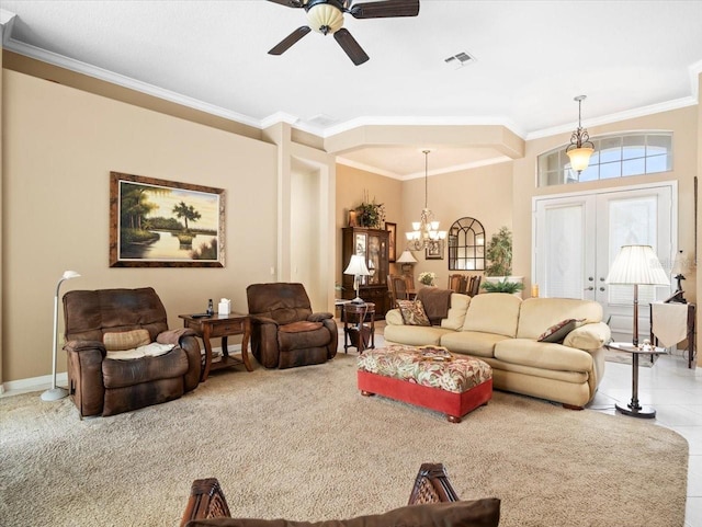 living room featuring ceiling fan with notable chandelier, french doors, ornamental molding, and carpet floors