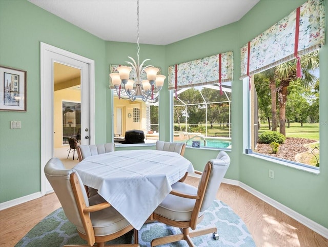 dining room featuring a chandelier and hardwood / wood-style floors