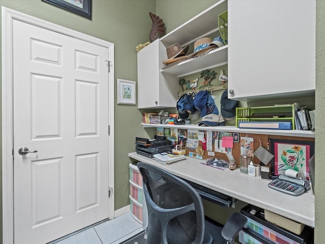 home office with light tile patterned floors