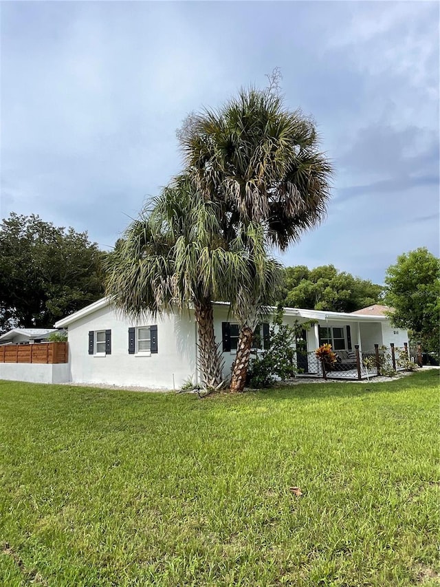 back of house with a yard