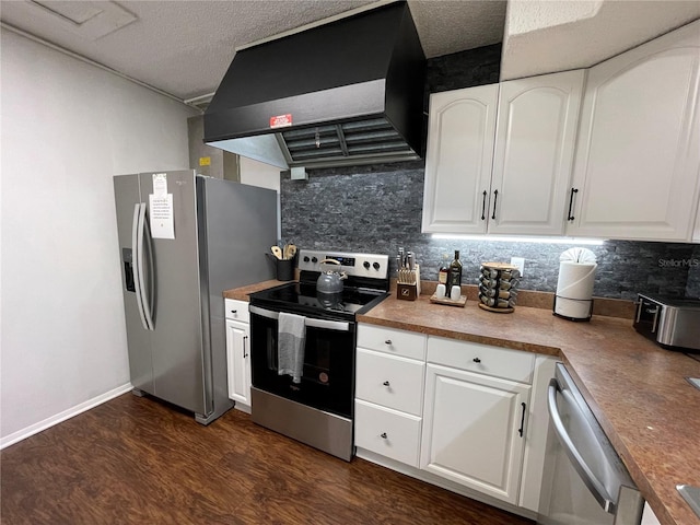 kitchen featuring white cabinetry, dark hardwood / wood-style floors, wall chimney range hood, and stainless steel appliances