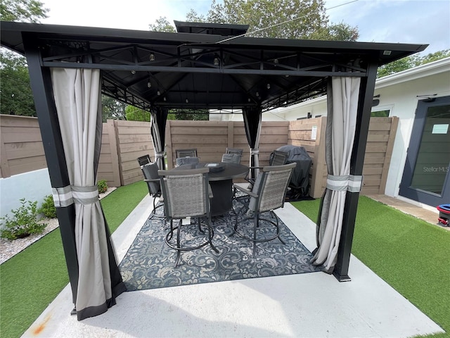 view of patio featuring grilling area and a gazebo