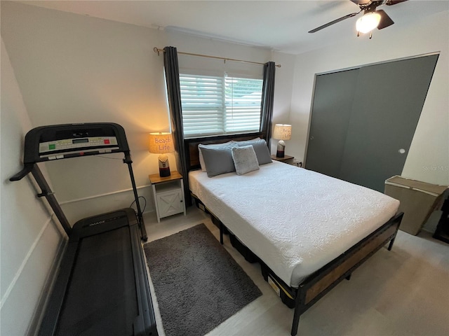 carpeted bedroom featuring a closet and ceiling fan