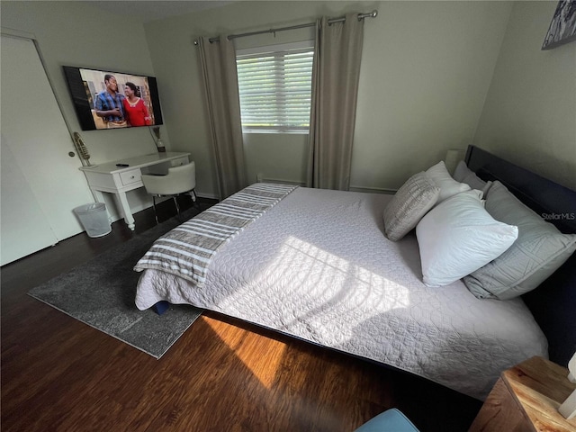 bedroom featuring dark wood-type flooring