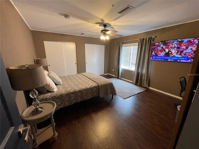 bedroom with ceiling fan, a closet, and dark hardwood / wood-style floors