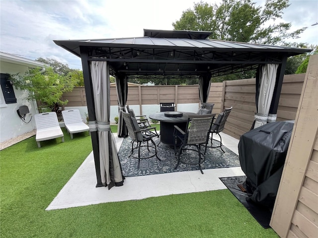 view of patio / terrace with a grill and a gazebo