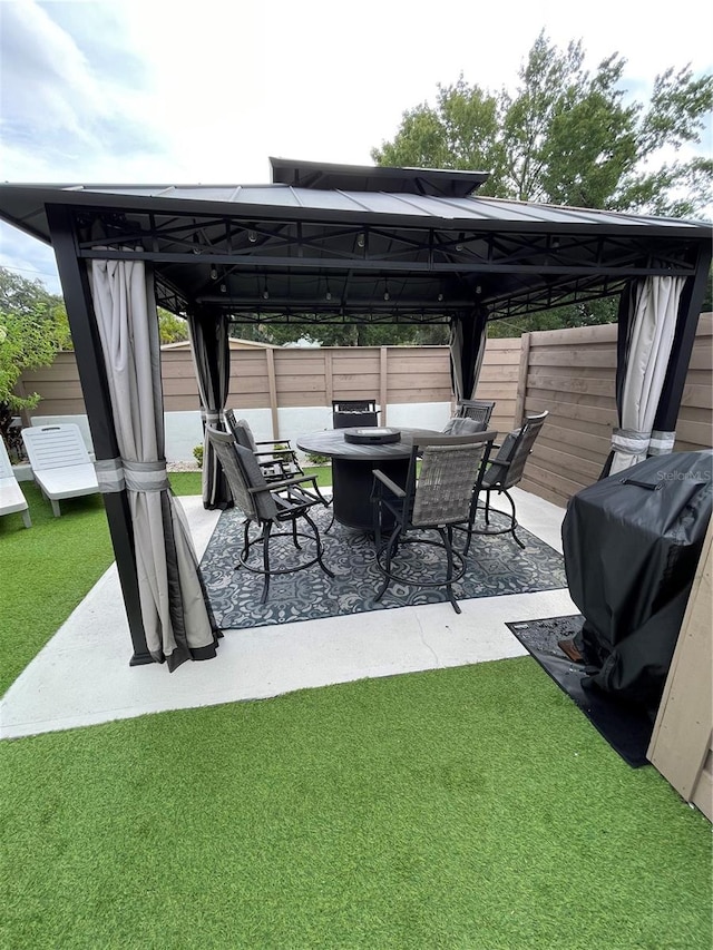 view of patio / terrace with a gazebo and a grill