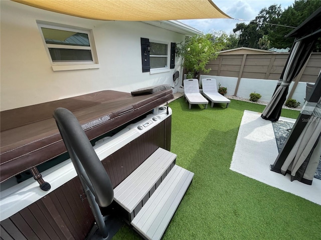 exterior space featuring carpet floors and a jacuzzi