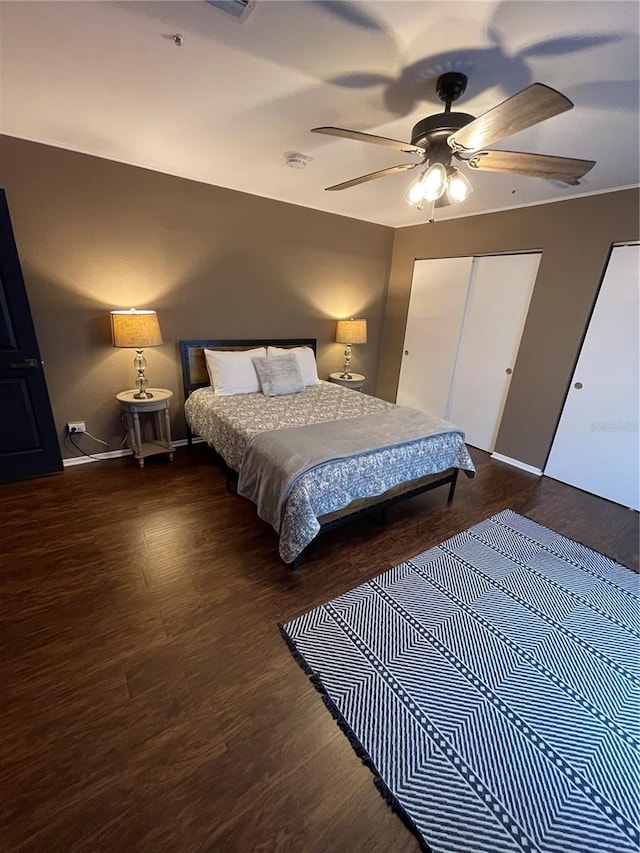 bedroom featuring dark hardwood / wood-style floors and ceiling fan