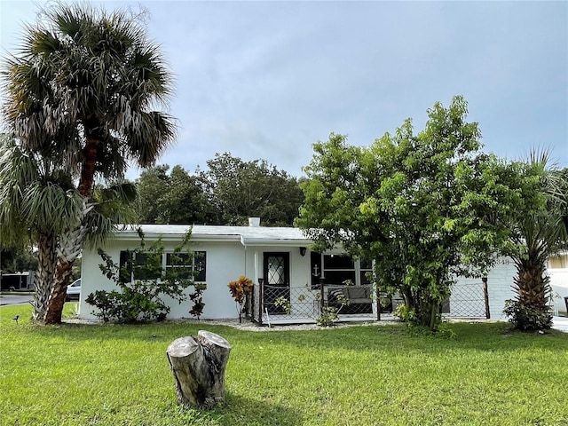 exterior space featuring a front lawn