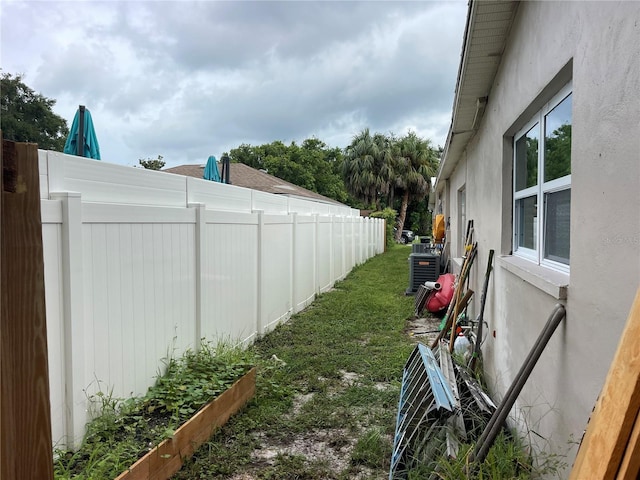 view of yard featuring central AC unit