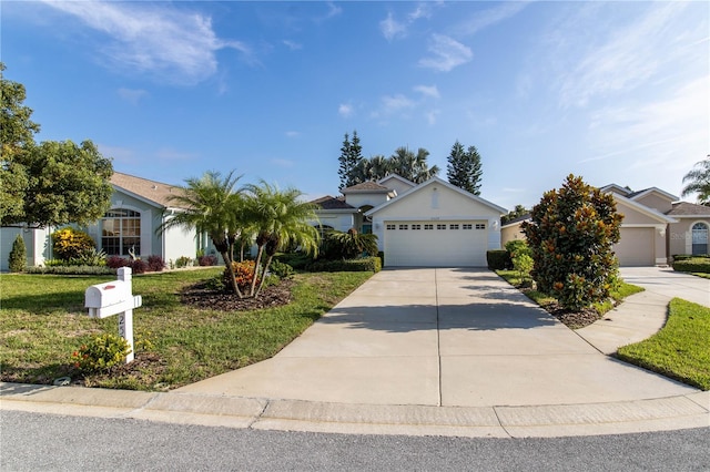 view of front of home featuring a front yard and a garage