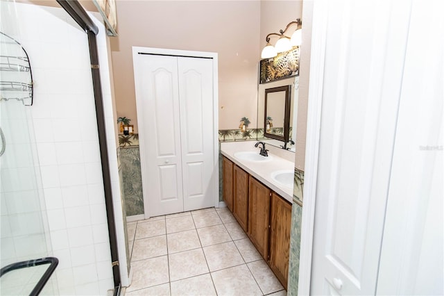 bathroom featuring vanity, a shower with door, and tile patterned floors