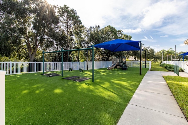 view of community with a playground and a lawn