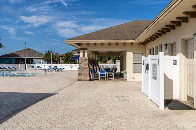 view of home's community featuring a patio and a swimming pool