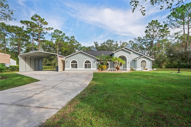 view of front of property featuring a front lawn and a carport