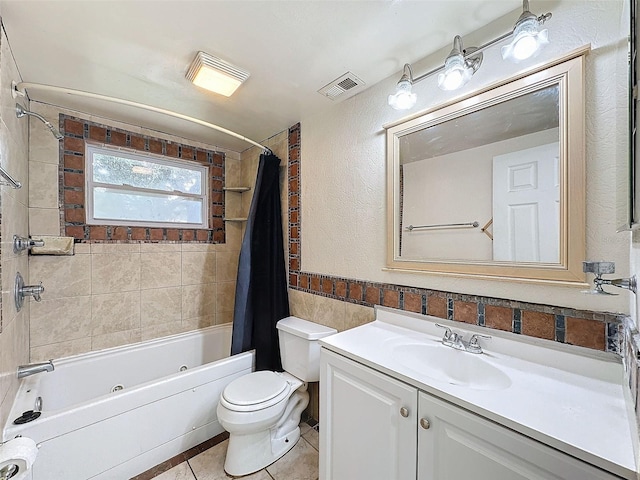 7206 Ashwood Dr, Port Richey, FL 34668 - full bath with shower / bath combination with curtain, toilet, vanity, tile walls, and tile patterned floors