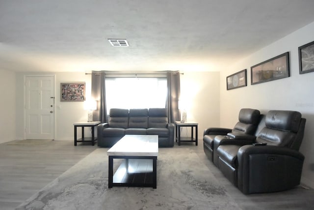 living room with light hardwood / wood-style flooring