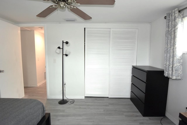 bedroom featuring a closet, ceiling fan, and wood-type flooring