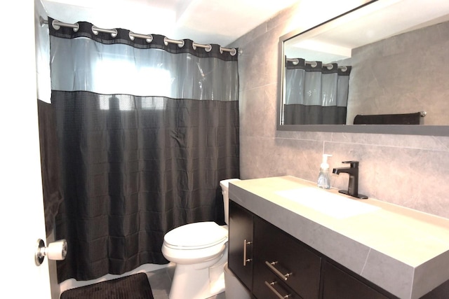 bathroom with vanity, walk in shower, tile walls, toilet, and decorative backsplash