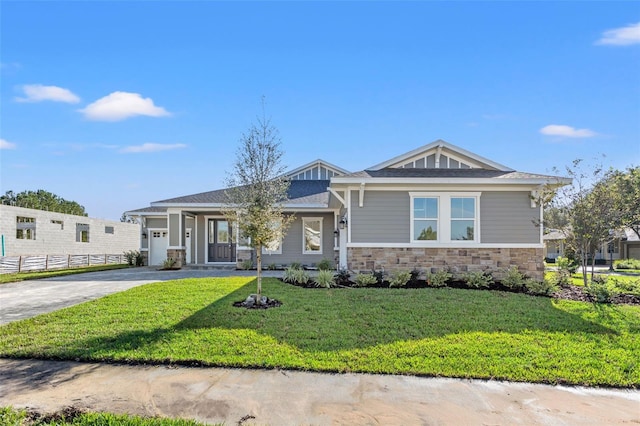 view of front facade with a front lawn and a garage