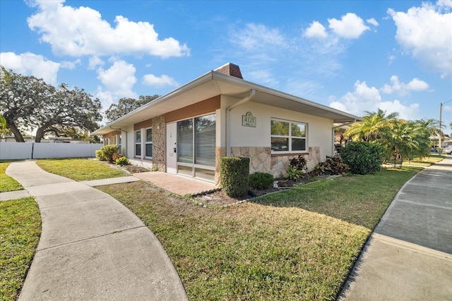 view of home's exterior featuring a yard