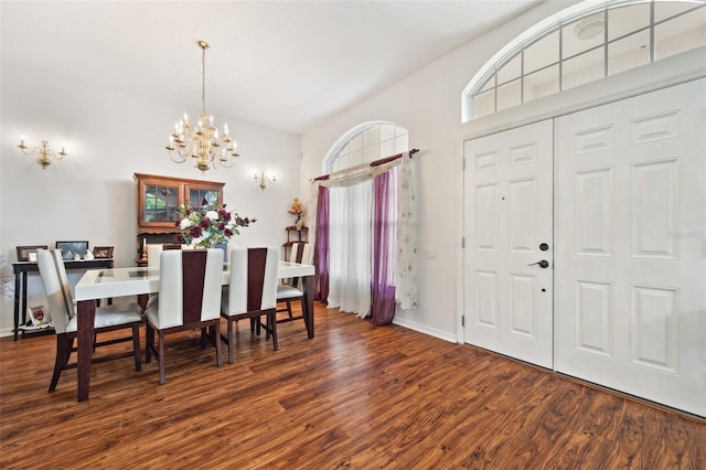 dining space featuring a notable chandelier and dark hardwood / wood-style floors