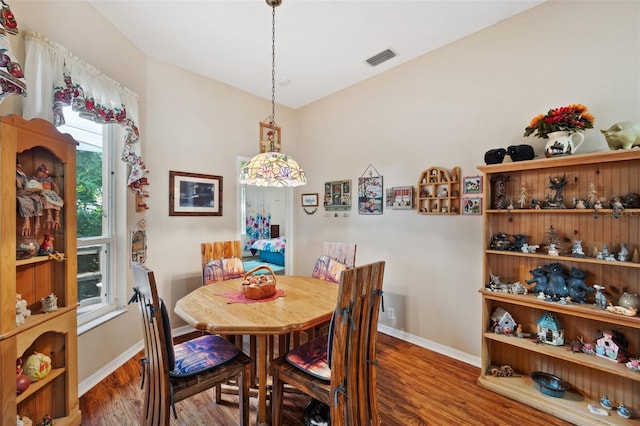 dining area featuring dark hardwood / wood-style floors