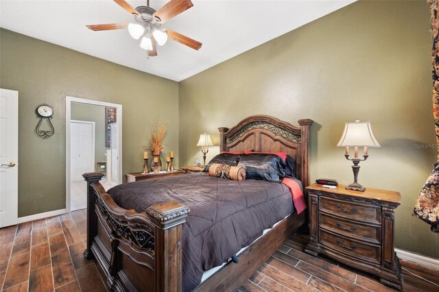 bedroom featuring dark hardwood / wood-style flooring and ceiling fan