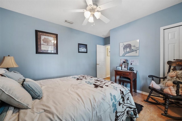 bedroom with ceiling fan and a closet