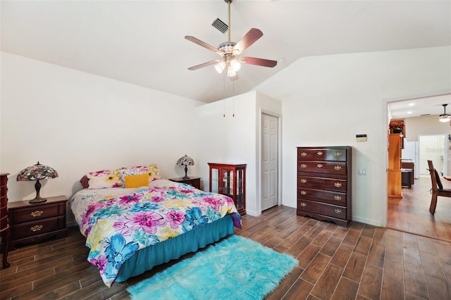 bedroom featuring ceiling fan, vaulted ceiling, and dark hardwood / wood-style flooring