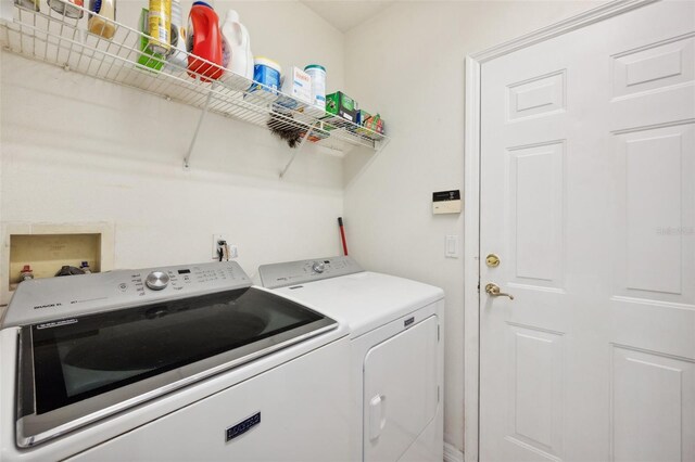 washroom featuring independent washer and dryer