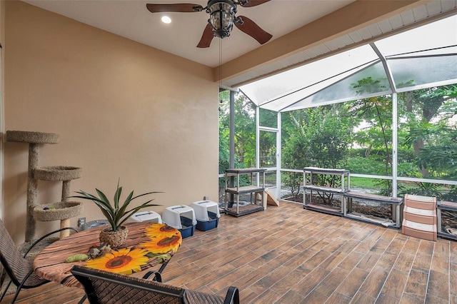 sunroom / solarium with ceiling fan