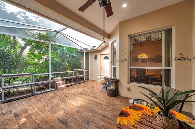 sunroom / solarium featuring vaulted ceiling and ceiling fan