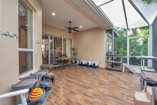 exterior space with ceiling fan and a skylight