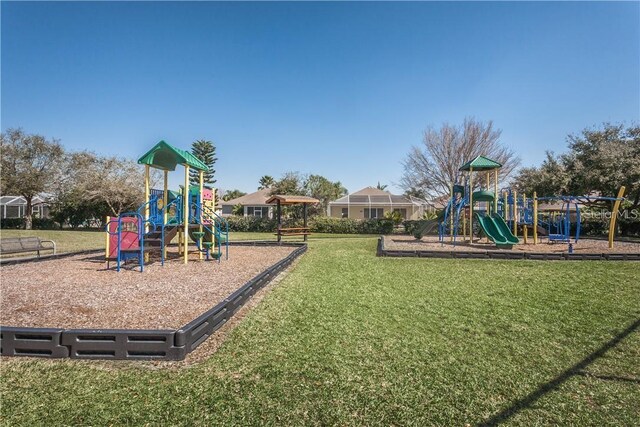 view of jungle gym with a lawn